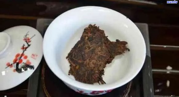 新普洱熟茶饼的冲泡 *** 与煮茶效果对比探讨